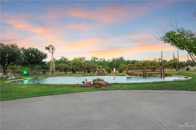 5051 Iowa Rd, Mission, TX 78574 - view of property's community with a lawn and a water view