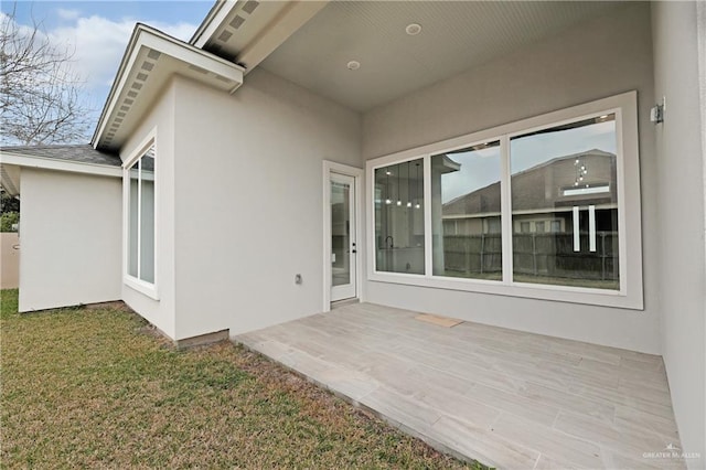 exterior space featuring a patio and a lawn