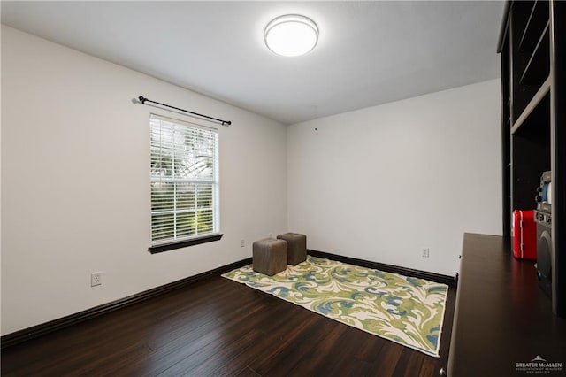 empty room with dark hardwood / wood-style floors