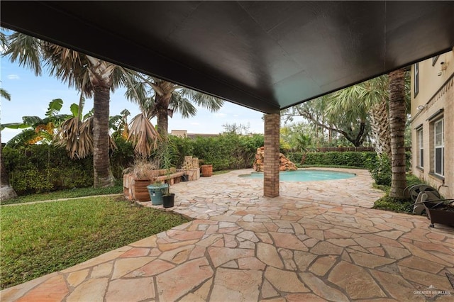 view of patio / terrace with a fenced in pool