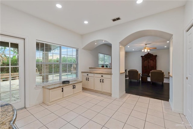 bathroom featuring ceiling fan, tile patterned flooring, and vanity