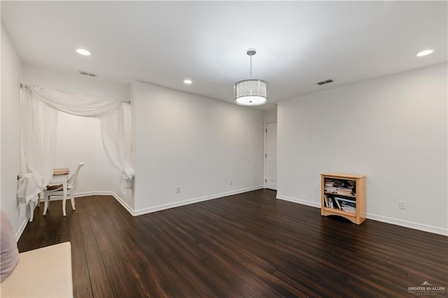 empty room featuring dark wood-type flooring