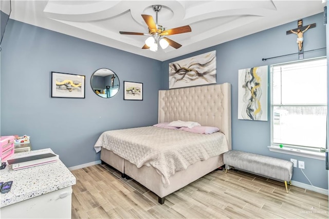 bedroom featuring light hardwood / wood-style floors and ceiling fan