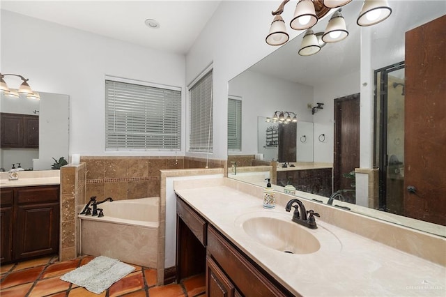 bathroom with vanity, a tub to relax in, and tile patterned floors