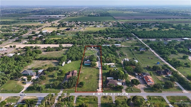 aerial view of property and surrounding area featuring property parcel outlined and rural landscape