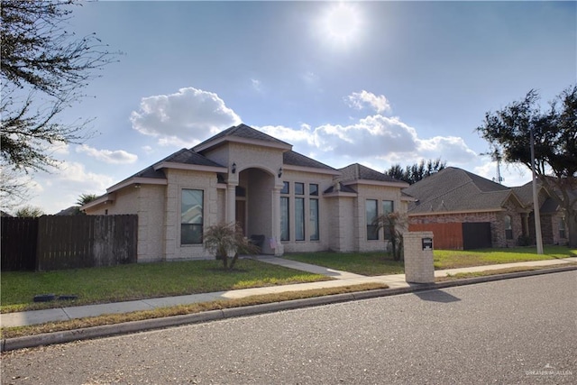 view of front of home with a front lawn