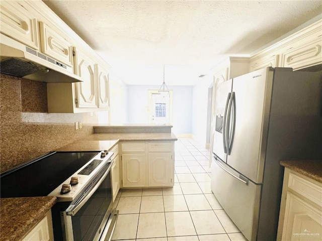 kitchen featuring backsplash, kitchen peninsula, decorative light fixtures, light tile patterned floors, and appliances with stainless steel finishes