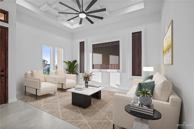 living room featuring ceiling fan, baseboards, coffered ceiling, beam ceiling, and recessed lighting