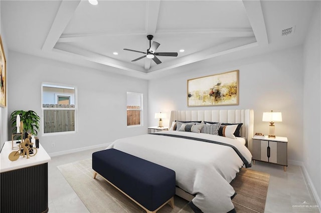bedroom with a ceiling fan, a tray ceiling, baseboards, visible vents, and recessed lighting