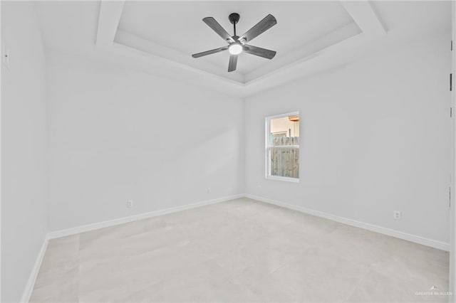 unfurnished room with a tray ceiling and ceiling fan