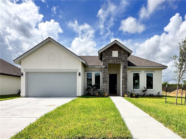 view of front of home featuring a garage and a front yard