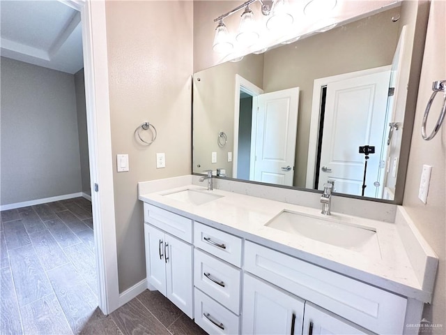 bathroom featuring hardwood / wood-style floors and vanity