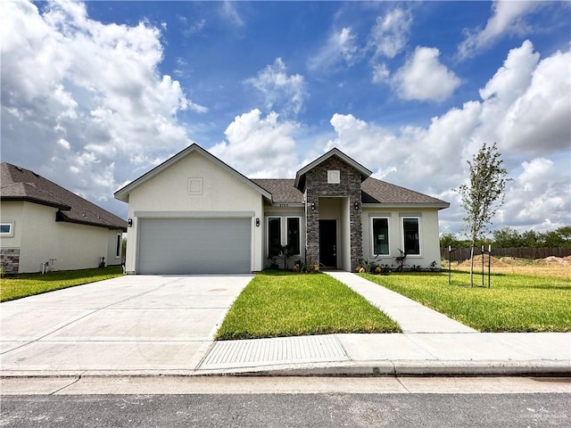 view of front of home featuring a garage and a front lawn