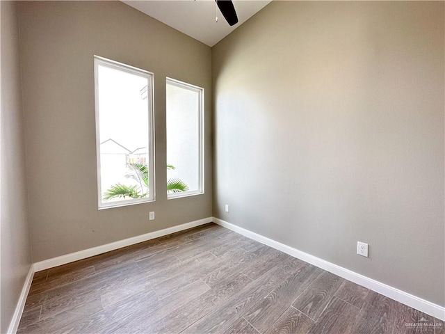 spare room featuring ceiling fan and light hardwood / wood-style floors