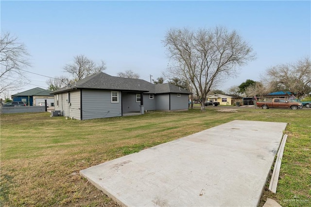 501 W Iowa St, Harlingen, TX 78552 - rear view of house with a patio area, central AC unit, and a yard