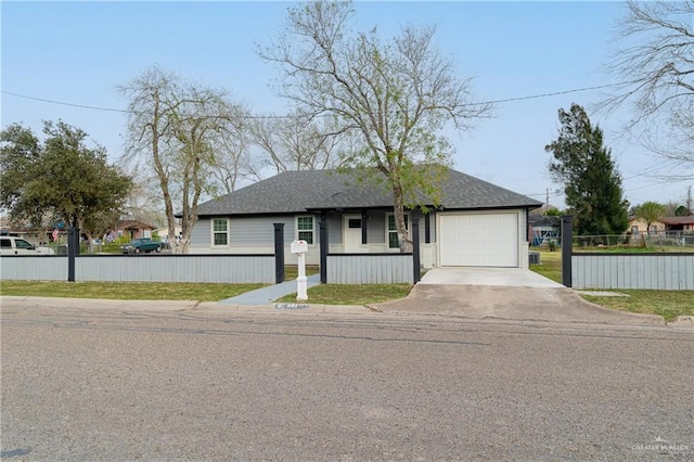 view of front of property featuring a garage, driveway, a fenced front yard, and roof with shingles