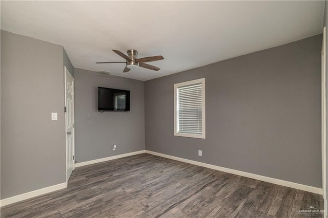 501 W Iowa St, Harlingen, TX 78552 - empty room featuring ceiling fan, baseboards, and dark wood finished floors