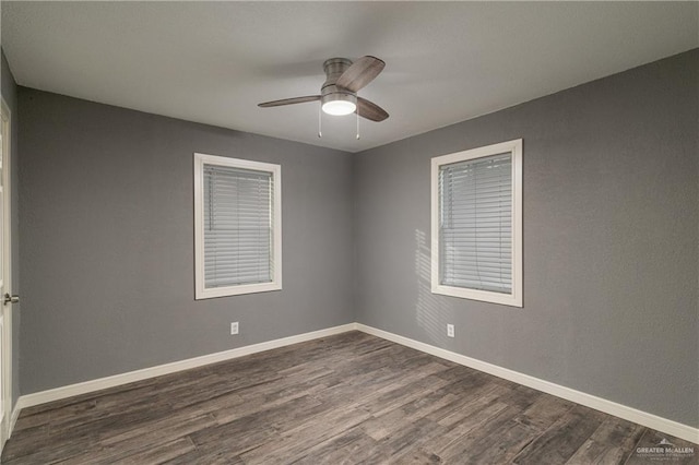 501 W Iowa St, Harlingen, TX 78552 - empty room with baseboards, dark wood finished floors, and a ceiling fan