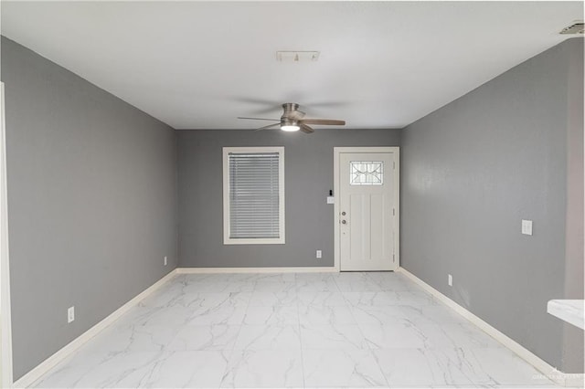 501 W Iowa St, Harlingen, TX 78552 - foyer with marble finish floor, visible vents, baseboards, and a ceiling fan