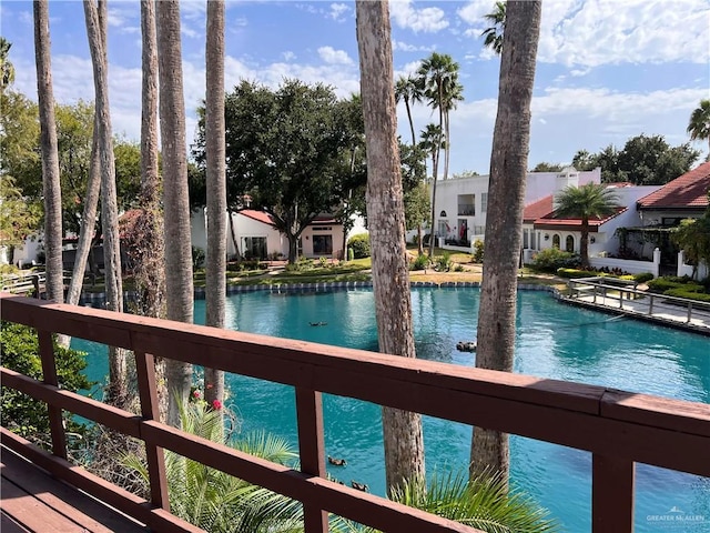 view of pool with a water view