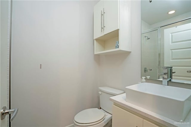 2008 S Erica St, Pharr, TX 78577 - bathroom featuring toilet, vanity, and a shower with door