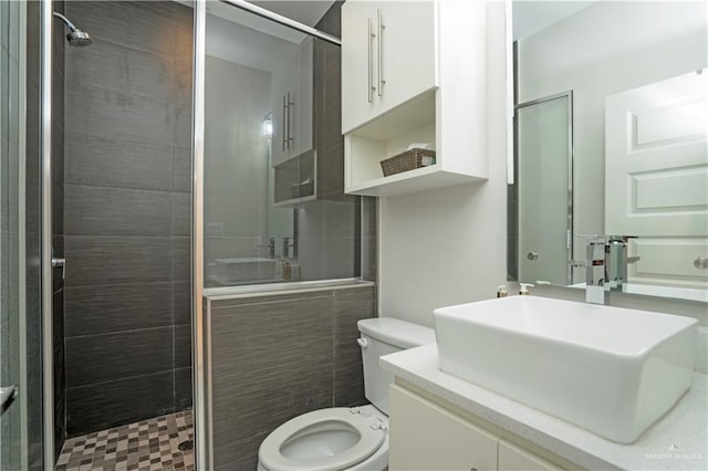 2008 S Erica St, Pharr, TX 78577 - full bath featuring a stall shower, toilet, and vanity
