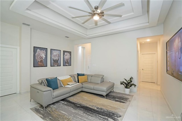 2008 S Erica St, Pharr, TX 78577 - living area featuring a tray ceiling, light marble finish flooring, and a ceiling fan