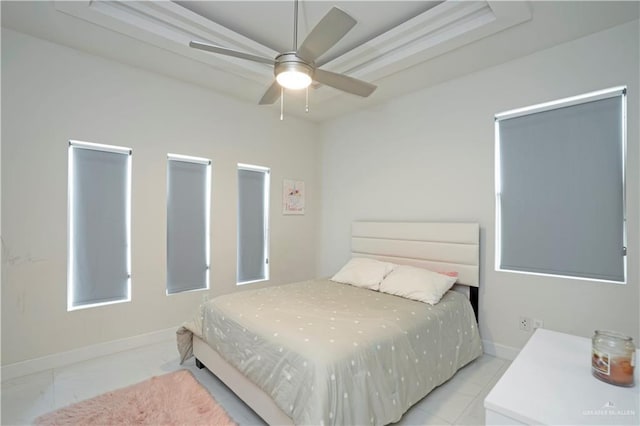 2008 S Erica St, Pharr, TX 78577 - bedroom with a tray ceiling, baseboards, and ceiling fan