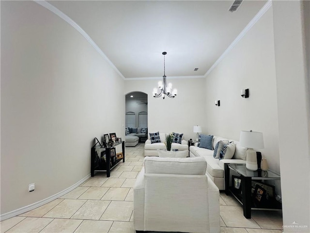 5809 N 3rd St, Mcallen, TX 78504 - living room featuring a chandelier, light tile patterned flooring, ornamental molding, and arched walkways