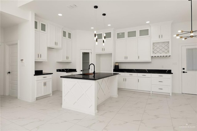 kitchen with recessed lighting, a sink, white cabinetry, marble finish floor, and a chandelier