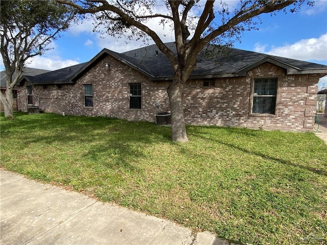 view of property exterior with cooling unit and a lawn