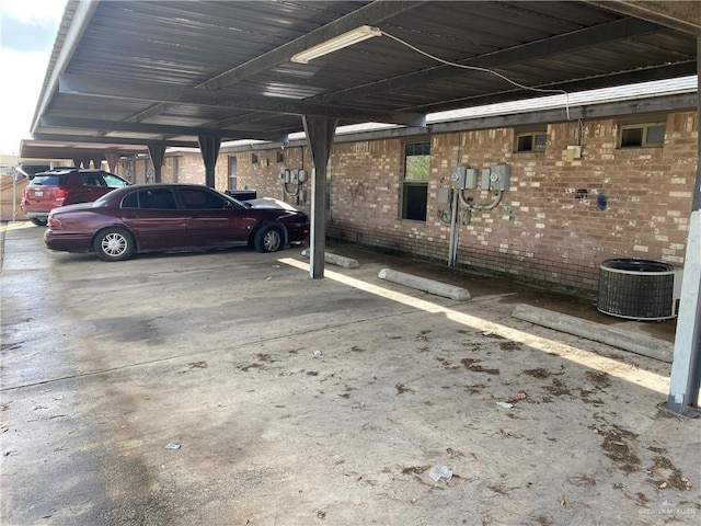 view of parking / parking lot featuring a carport