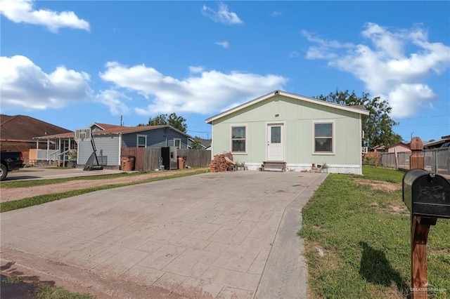 3411 Juan St, Edinburg, TX 78541 - manufactured / mobile home featuring concrete driveway, entry steps, and a residential view