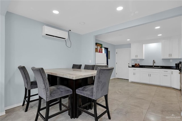 3411 Juan St, Edinburg, TX 78541 - dining area featuring a wall mounted air conditioner and recessed lighting