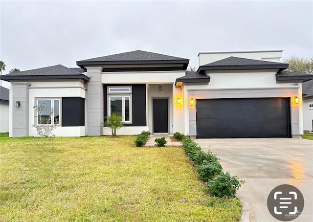 prairie-style house with a front yard and a garage