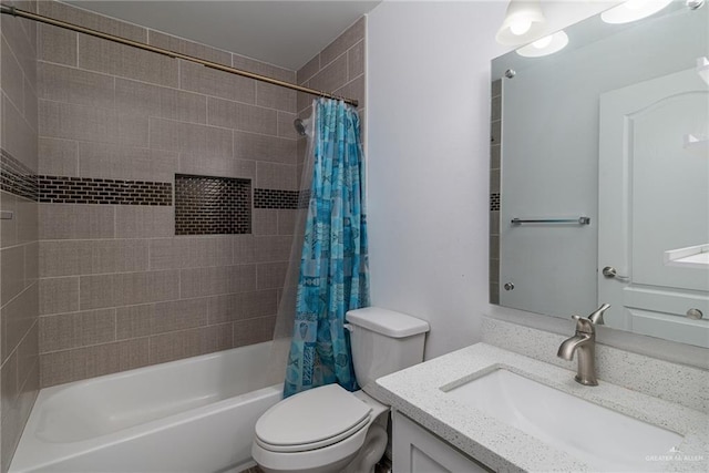 full bathroom featuring vanity, shower / bathtub combination with curtain, and toilet