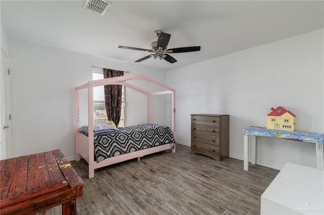 bedroom with hardwood / wood-style flooring and ceiling fan