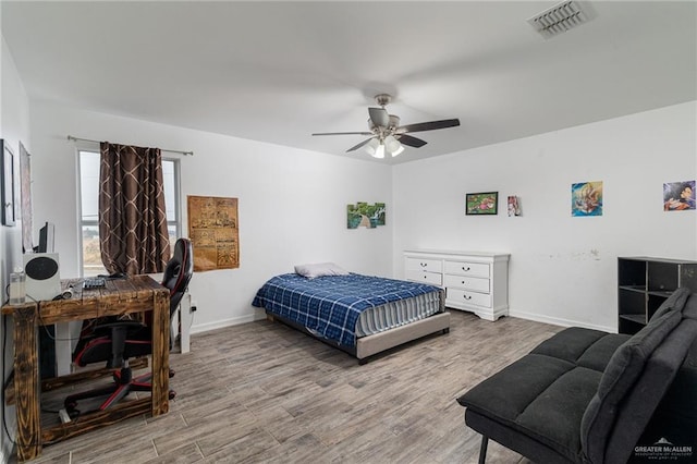 bedroom featuring ceiling fan and hardwood / wood-style floors