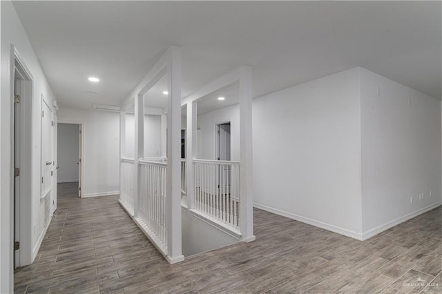 corridor featuring wood-type flooring