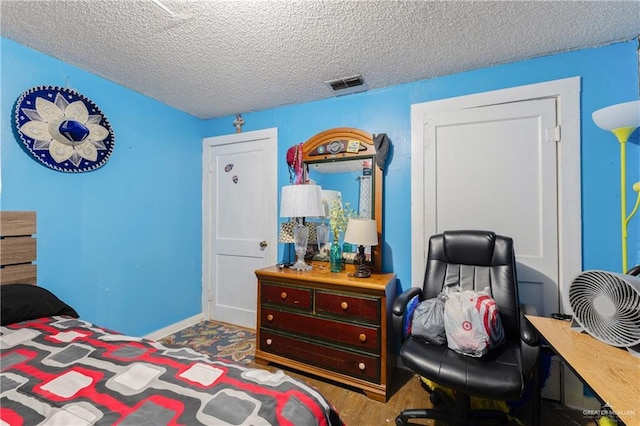 1914 W Barcelona Ave, Harlingen, TX 78550 - bedroom featuring visible vents and a textured ceiling