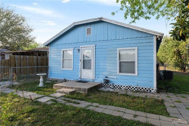 1914 W Barcelona Ave, Harlingen, TX 78550 - back of house featuring central AC unit and fence