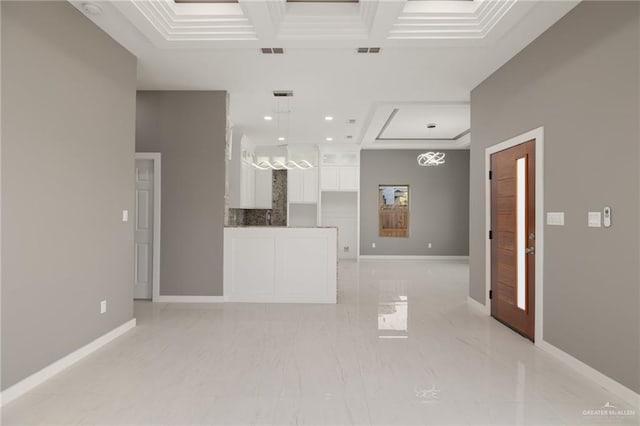 interior space with beamed ceiling, a towering ceiling, ornamental molding, and coffered ceiling