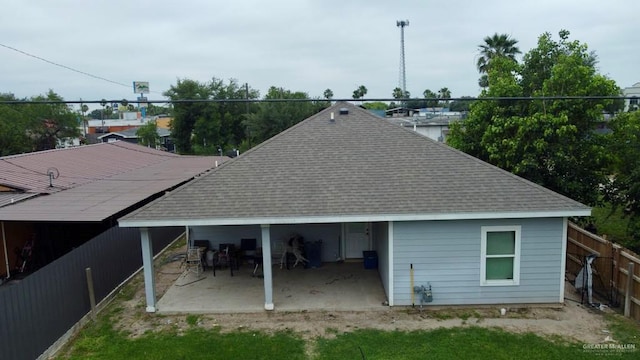 816 Leal St, Mission, TX 78572 - back of house with a fenced backyard, a shingled roof, and a patio area