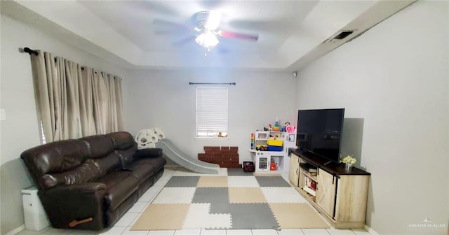 621 N Nevada Ave, Weslaco, TX 78596 - living area with ceiling fan and a tray ceiling