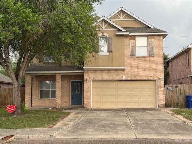 4717 Violet Ave, Mcallen, TX 78504 - view of front facade featuring a garage, fence, stucco siding, brick siding, and driveway