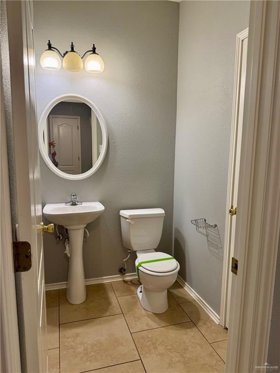 4717 Violet Ave, Mcallen, TX 78504 - half bath with baseboards, tile patterned floors, and toilet