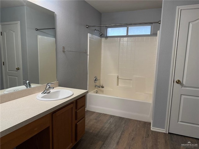 4717 Violet Ave, Mcallen, TX 78504 - full bath featuring vanity, a textured wall, wood finished floors, and tub / shower combination