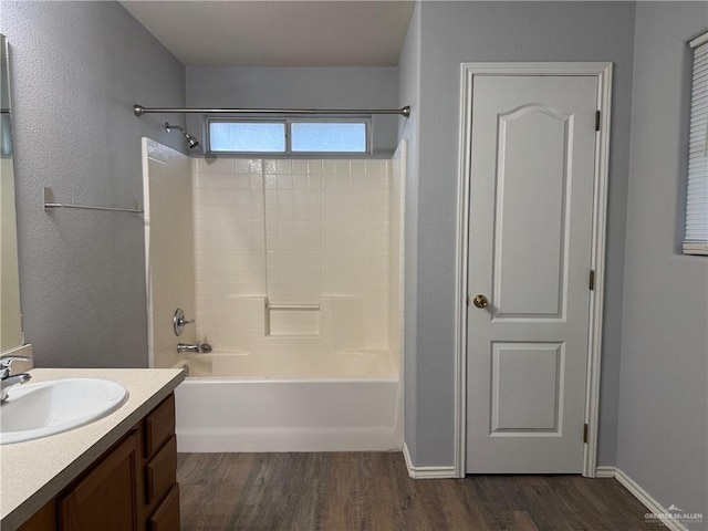 4717 Violet Ave, Mcallen, TX 78504 - bathroom with vanity, washtub / shower combination, and wood finished floors