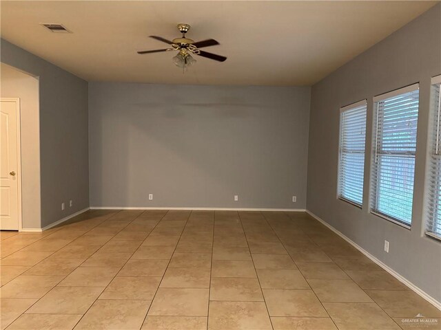 4717 Violet Ave, Mcallen, TX 78504 - empty room with light tile patterned floors, baseboards, a ceiling fan, and visible vents