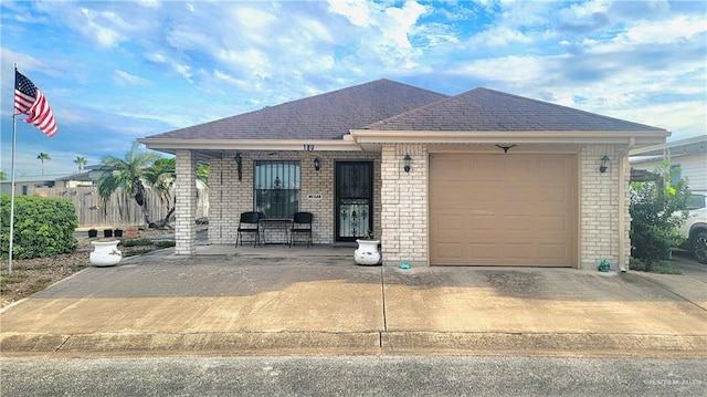 view of front facade featuring covered porch and a garage